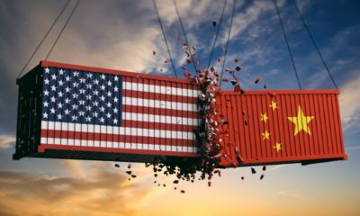USA and China trade war. US of America and chinese flags crashed containers on sky-us china relations-ss-featured