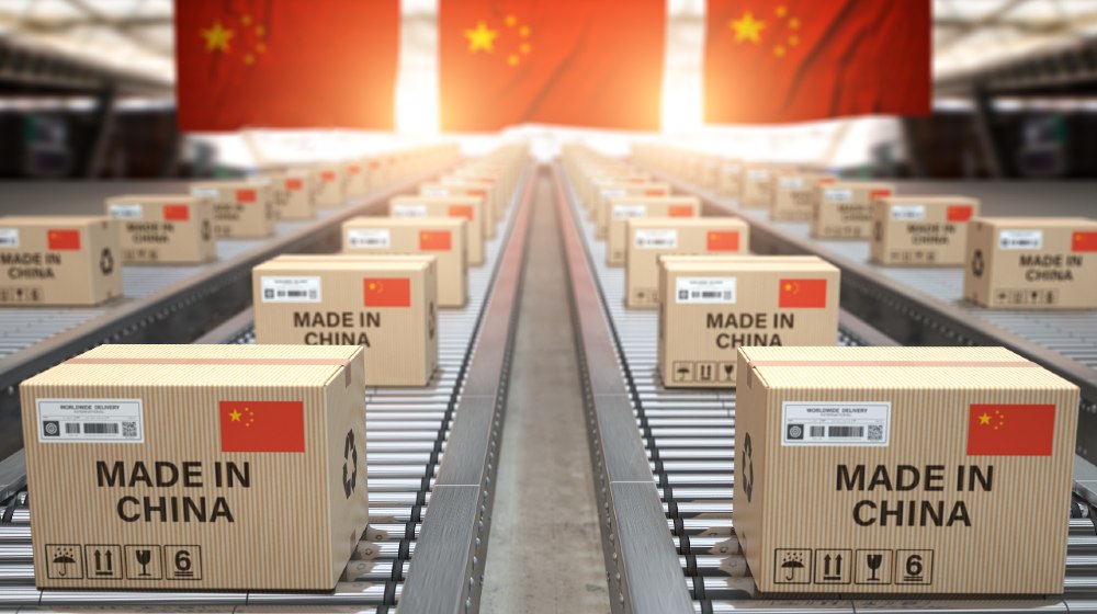 Made in China. Cardboard boxes with text made in China and chinese flag on the roller conveyor-China's 3rd Quarter GDP-ss-featured