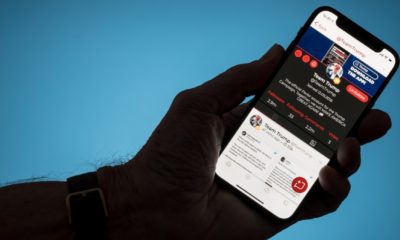 Modern phone with Parler social media app displaying Team Trump account in dispute with Twitter-Cut Ties With Parler-ss-featured