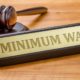 A gavel and a name plate with the engraving Minimum Wage rates-Minimum Wage-ss-featured