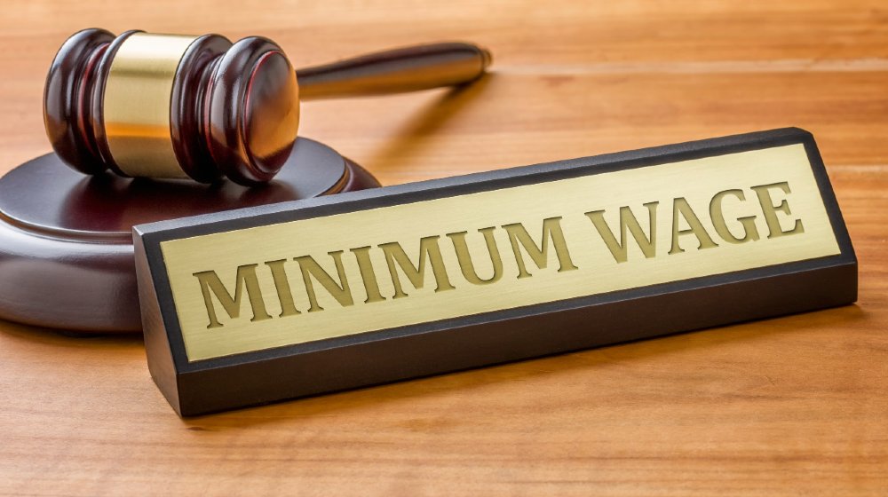A gavel and a name plate with the engraving Minimum Wage-Minimum Wage-ss-featured