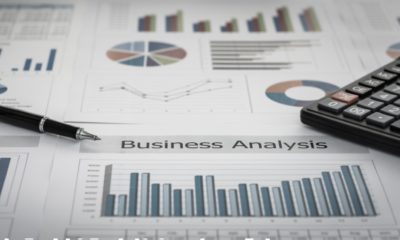 Business graphs and charts report with pen, calculator on desk of financial advisor-Credit and Financial Services-SS-Featured