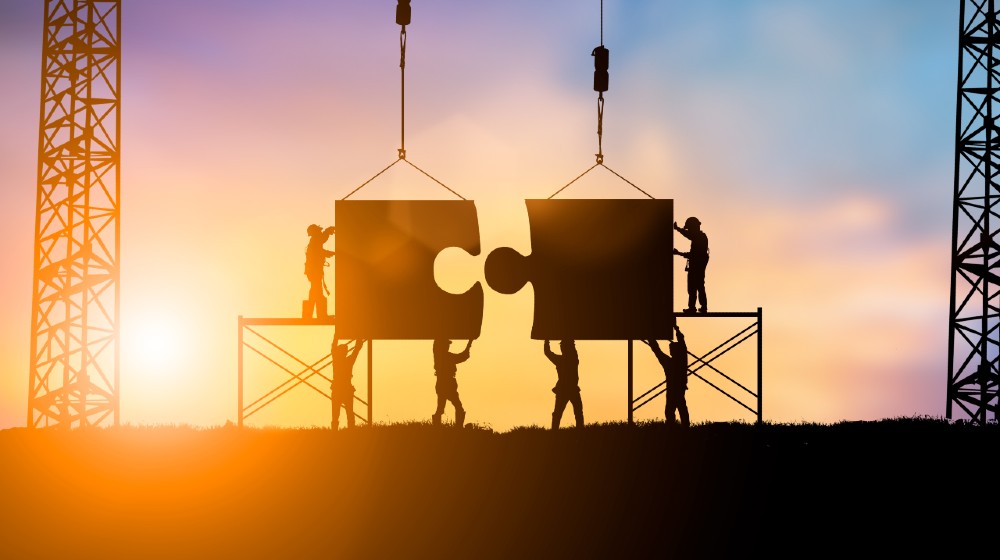 Silhouette Team business engineer work connecting jigsaw puzzle pieces together Teamwork potential and motivate employee to growth-Capital Goods-ss-featured