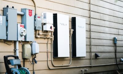 Tesla Powerwall Home battery storage connecting home energy storage with solar panels and powering the grid with a self sustaining future-Megabattery-ss-featured