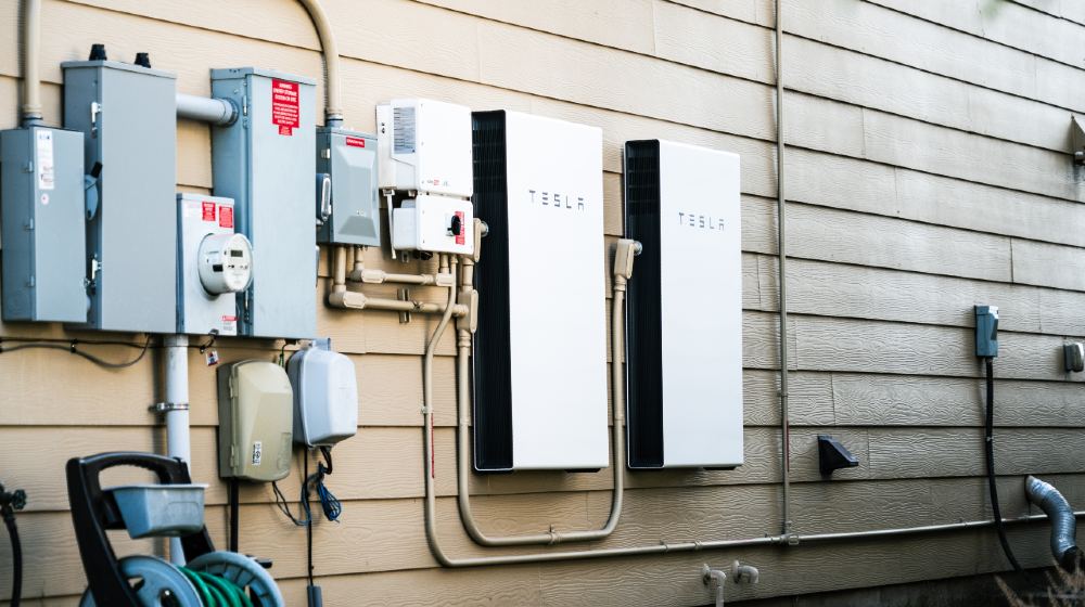 Tesla Powerwall Home battery storage connecting home energy storage with solar panels and powering the grid with a self sustaining future-Megabattery-ss-featured