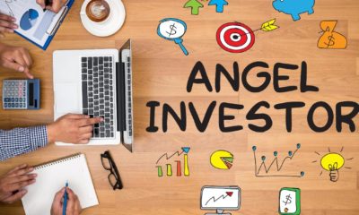 ANGEL INVESTOR Business team hands at work with financial reports and a laptop-angel investing-ss-featured