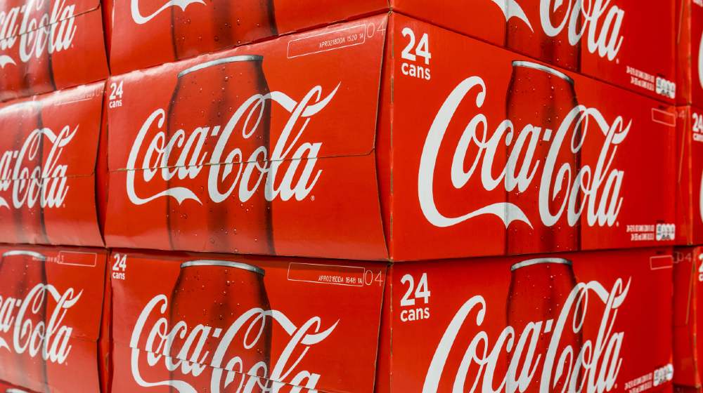 Cases of Coca Cola on display on a grocery store shelf-boycott coke-ss-featured