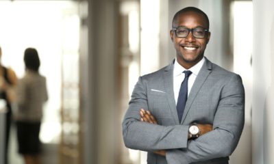 Handsome cheerful african american executive business man at the workspace office-Successful Business | Characteristics of a Successful Business | Featured