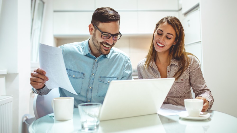 Shot of a young couple using a laptop while working on their home finances | Avoid These Five Mistakes When Submitting Your Business Plan | Featured