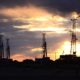 the drilling rigs against a sun dawn-uranium-ss-featured