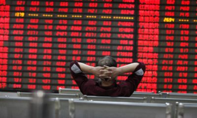 An investor watchs electric board in a stock market in Huaibei | What Is a "Blood in the Streets" Moment? | Featured