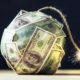 Big bomb of money hundred dollar bills with a burning wick. Little time before the explosion | Is Inflation The New Market Boogeyman? Experts Weigh In | Featured