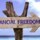 Financial Freedom wooden sign with a beach on background | The Way to Financial Freedom and Independence | Featured