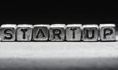Inscription startup on metal cubes in grunge style on a black background isolated | Why the Startup Market Could Boom in 2021 | Featured