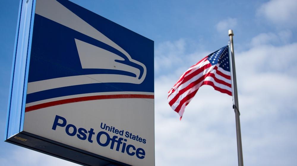 United State Postal Service sign with American Flag-US Postal Service-SS-Featured