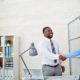 Young employer congratulating newly hired man | 9 critical strategies to attract and retain new workers | Featured