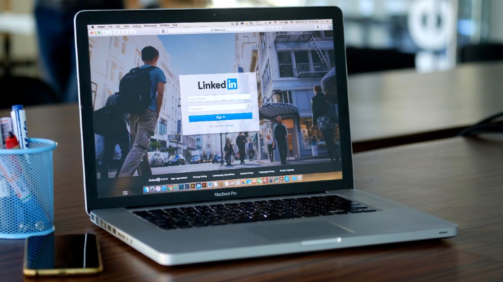 Apple Macbook pro with page social network service LinkedIn on the screen | Discover the LinkedIn App That Will Send Send Your Sales Through the Roof | featured