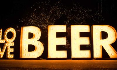 Brewery Lights at the Anheuser-Busch Budweiser Tours with huge love beer sign | Anheuser-Busch To Give Free Beer Once US Vax Rate Hits 70% | Featured