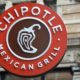 Chipotle Mexican Grill signboard on the wall in Boston. Chipotle is a chain of American restaurants | Chipotle To Raise Prices As Worker Pay Increases | featured