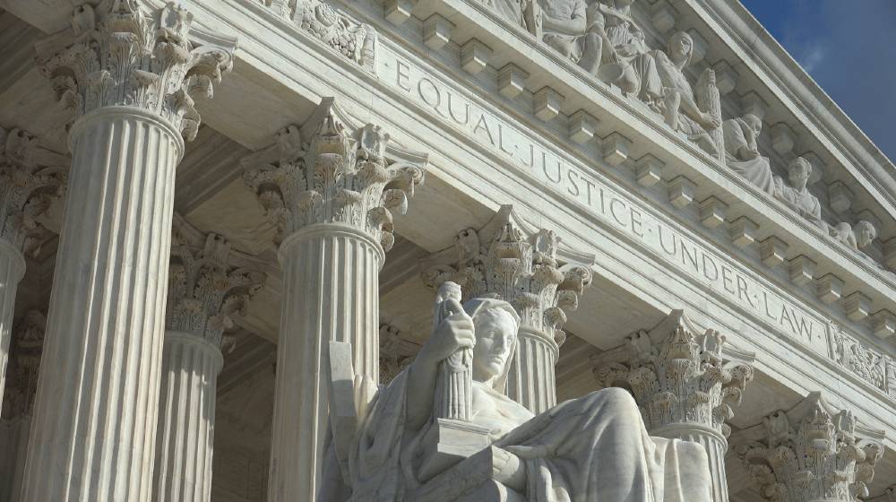 Equal Justice Under Law engraving above entrance to US Supreme Court Building | High court backs businesses challenging California labor law | featured