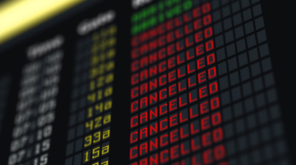 Flights canceled or delayed on information board | American Airlines Having Trouble Coping With Surging Demand | featured