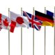 G7 flags Isolated Silk waving flags of countries of members Group of Seven Canada Germany Italy France Japan United States United Kingdom | G7 Nations Agree To 15% Minimum Corporate Tax | featured