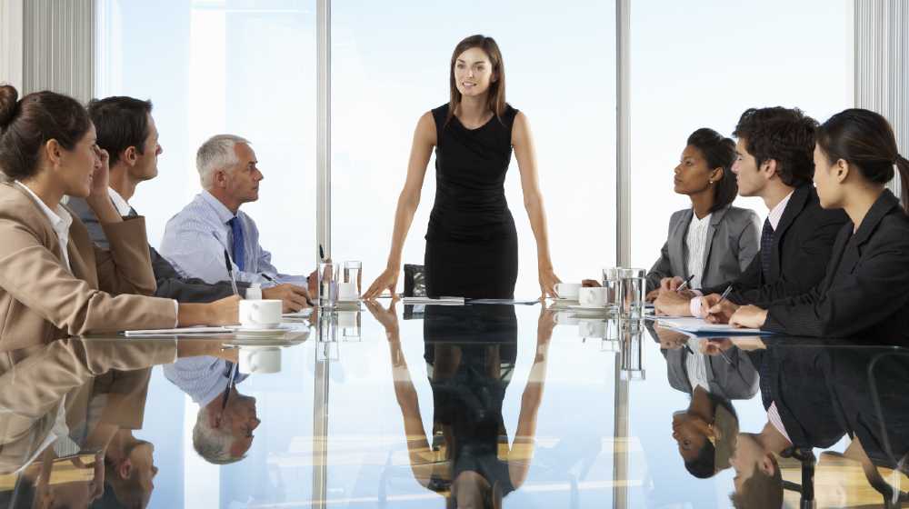 Group Of Business People Having Board Meeting Around Glass Table | Ladies, Start Your Engines. Get Your Business On The Road To Success | featured