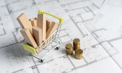 construction spending - High and low price concept. High angle above top view small miniature object of shopping cart full of sawmill construction materials | Timber! Lumber Prices Finally Going Down | featured