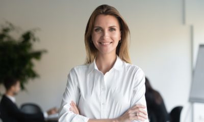 Smiling beautiful female professional manager standing with arms crossed looking at camera | Smart Hiring for CEO | featured