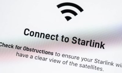 Starlink app on Apple iPhone screen. Starlink is a satellite internet constellation being constructed by SpaceX | Elon Musk Says Starlink To Have Half Million Users By 2021 | featured