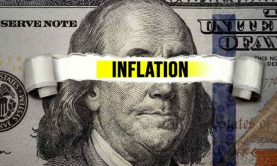 Torn bills revealing Inflation words. Idea for FED consider interest rate hike, world economics and inflation control | JPMorgan Hoarding Cash As Its Sees Longer Inflation Period | featured