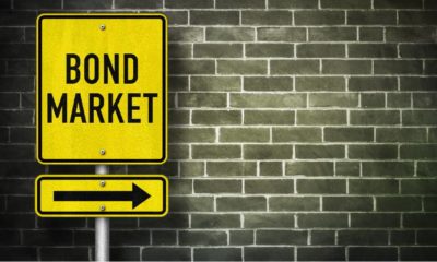 Bond Market - road sign illustration | Bond Market Agrees With Fed, Inflation Is Transitory | featured