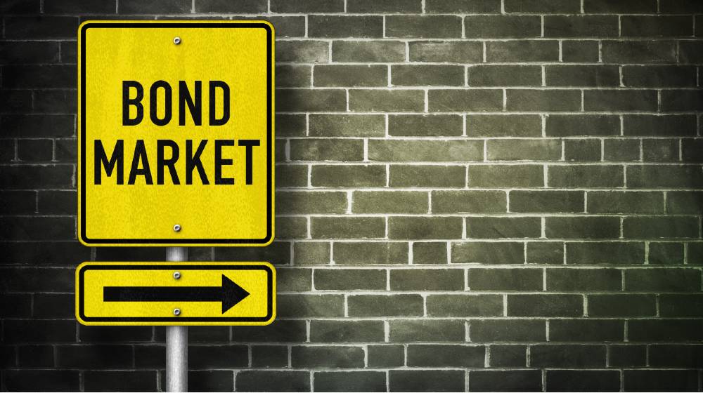 Bond Market - road sign illustration | Bond Market Agrees With Fed, Inflation Is Transitory | featured