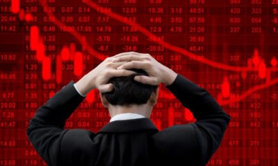 Businessman put his hands on his head feeling nervous and anxious about bad business | Bear Says Now Is Not A Good Time to Invest in Stocks | featured