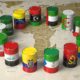 OPEC concept. Oil barrels in color of flags of countries memebers of OPEC on world political map | Oil Prices Hit $75/Barrel As OPEC Members Remain Divided | featured