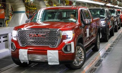 Trucks come off the assembly line at GM's Chevrolet Silverado and GMC Sierra pickup truck | GM Halts Pickup Production As Chip Shortage Continues | featured