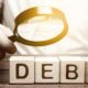 Businessman explores debt. Study of the structure of debt | All About Cleaning Up Your Credit & Choosing the Right Service | featured