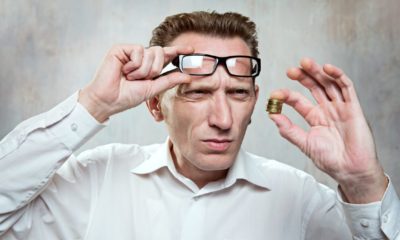 Office worker up his eyeglasses and look for a coins extremely surprise. Small salary concept | Runaway Inflation Is Wiping Out Gains From Higher Wages | featured