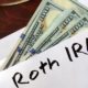 Roth IRA written on an envelope with dollars | Understanding the Use of Roth IRAs | featured
