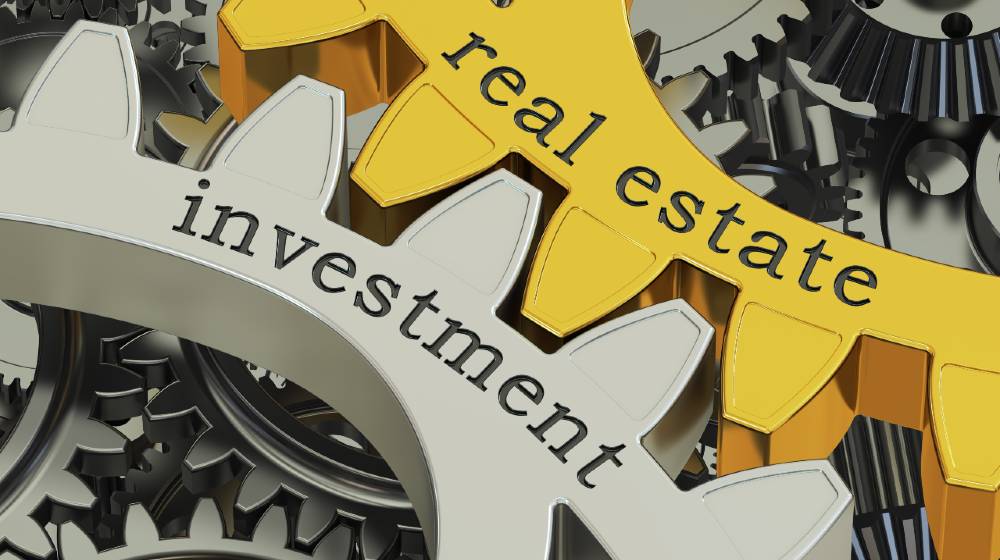 real estate investment concept on the gearwheels | 10 Mistakes That Keep You From Getting RICH In Real Estate Investing | featured