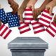 American-community-vote-and-US-voting-diversity-concept-and-diverse-hands-casting-United-States-ballots | Why Do American Voters Keep Letting Elected Officials Get Away With This? | featured