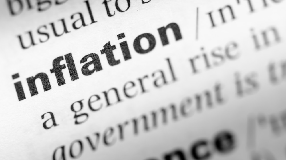 Close up of English dictionary page with word inflation | Inflation: Causes Perceptions, Concerns, Strategies, and Actions! | featured