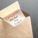 Congrats you got the job, a message inside a brown envelope | Weekly Jobless Claims Fall As Layoffs Post 24-Year Low | featured