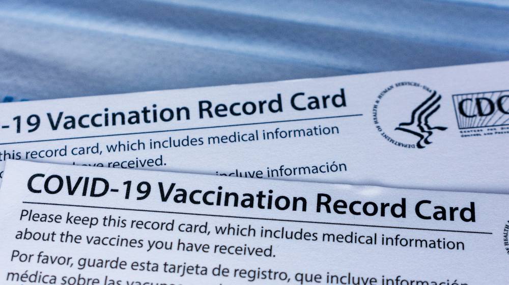 Covid-19 vaccination record cards issued by CDC | Majority of US Companies Want To Impose Vaccine Mandates | featured