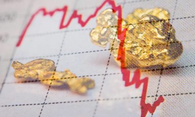 Gold nuggets and stock market graph | Gold Dips as Dollar Firms, Investors Eye Clues on U.S. CenBank Move | featured
