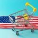 Mini supermarket shopping cart and abstract hand drawn American flag | US Retail Sales Increase Even As Delta Runs Wild | featured