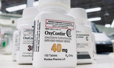 OxyContin bottle on counter | Courts Approve OxyContin Maker’s Bankruptcy Plan | featured