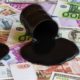 Spilled oil barrel on money bills of different countries | Crude Oil Forecast and Technical Analysis | featured