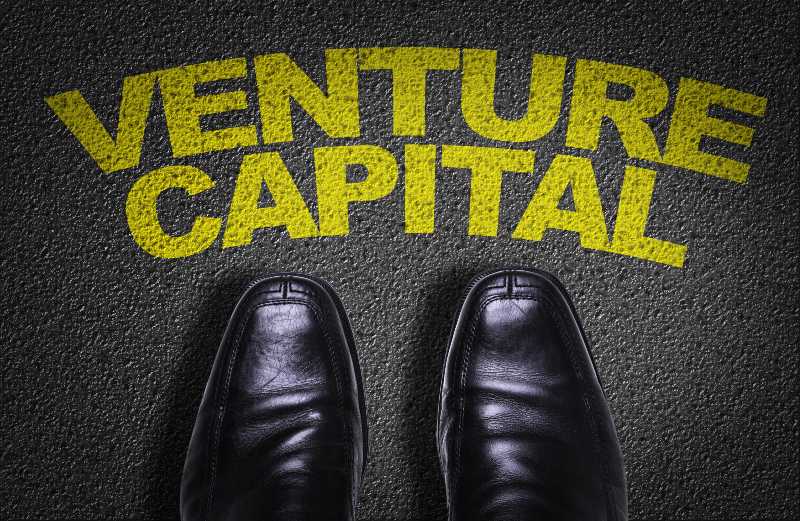 Top View of Business Shoes on the floor with the text Venture Capital-Venture Capitalist