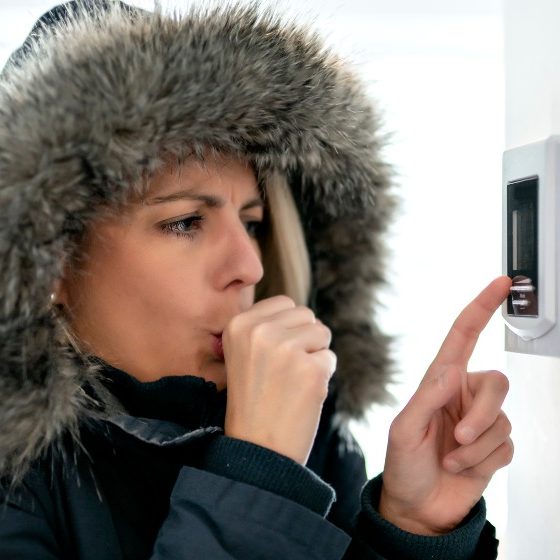 Woman With Warm Clothing Feeling The Cold Inside House-Natural Gas-SS-Featured